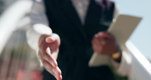 Business person, handshake and tablet with greeting for welcome, introduction or deal in city