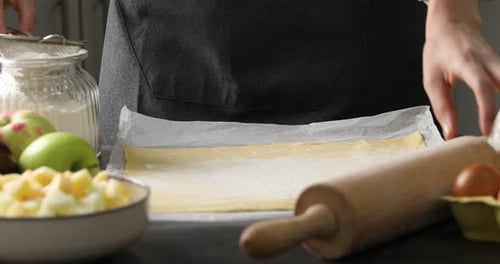 Preparing Apple Pie Dough in a Kitchen