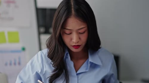 Business Woman is seriously stressed working and headache in the office.