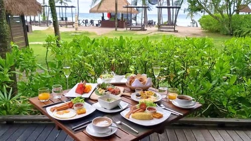 Luxury Breakfast Table on the Beach with Ocean View at the Tropical Island Koh Kood Thailand
