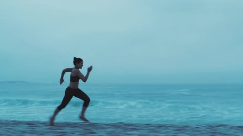 Fitness, sunset and woman running on beach for health or wellness
