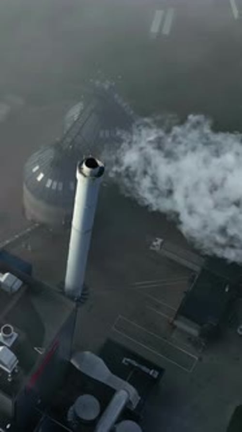 Aerial View of Industrial Chimney Emitting Smoke