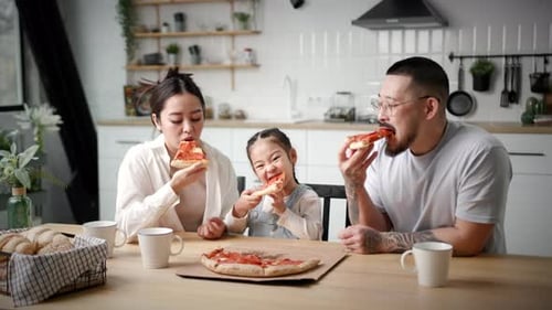 Family Enjoys Delicious Pizza Together at Home
