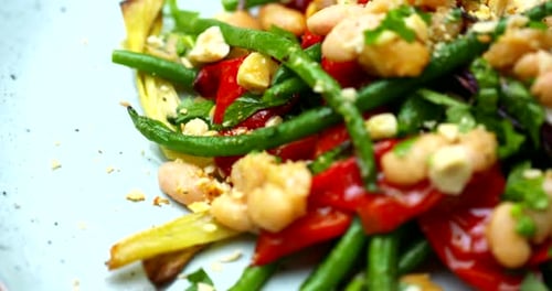 Roasted Green And White Beans On A Plate Rotating. Colourful Healthy Vegetables Shot In 4K