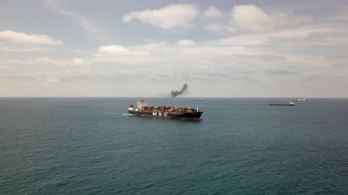 Aerial footage of a container ship at the East Mediterranean Sea.