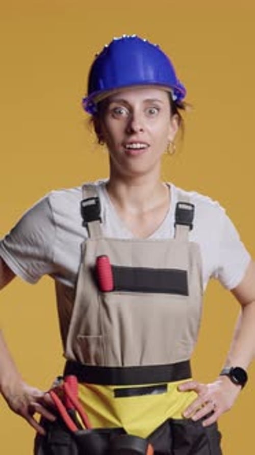 Vertical Video Portrait of Confident Handywoman Acting Curious and Exploring