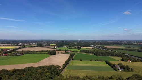 Aerial View of Lush Green Farmland on Sunny Day