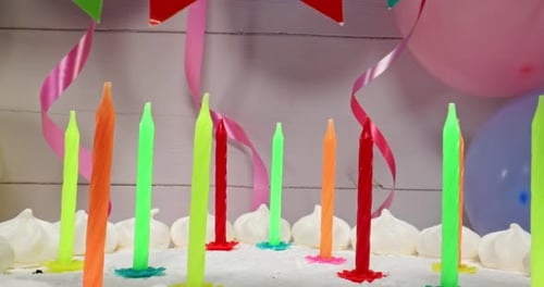 Festive Birthday Cake with Balloons and Party Banner