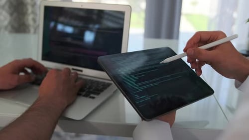 Team Improves the App Fixing Code on a Laptop