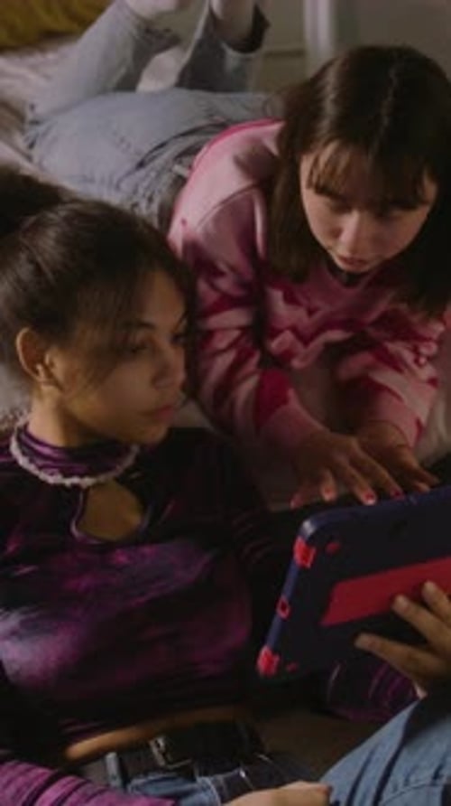 Multi Ethnic Girls Together Watches Content Using Tablet