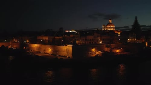 Aerial video of the city of Malta with the Saint's Cathedral in the evening