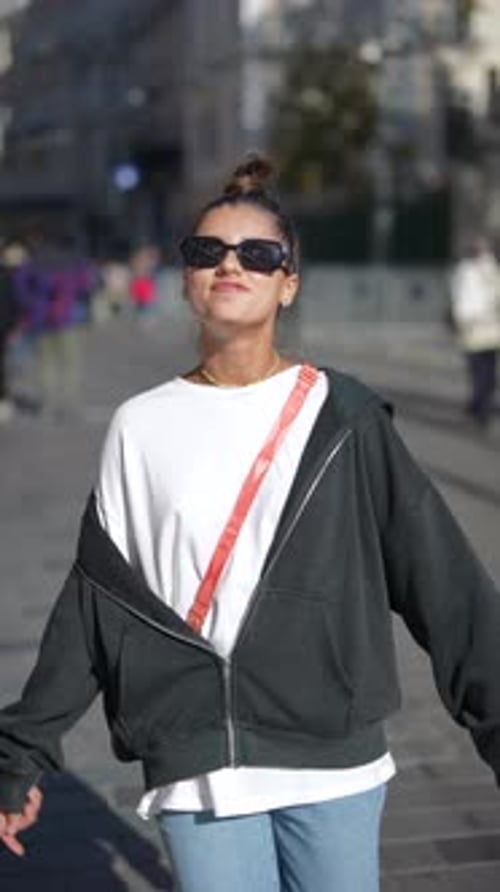 Stylish Urban Portrait A Confident Woman Walking Through a Bustling City Environment