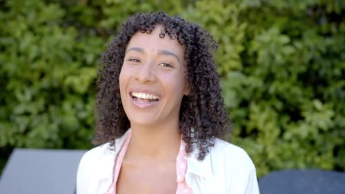 Smiling Woman with Curly Hair