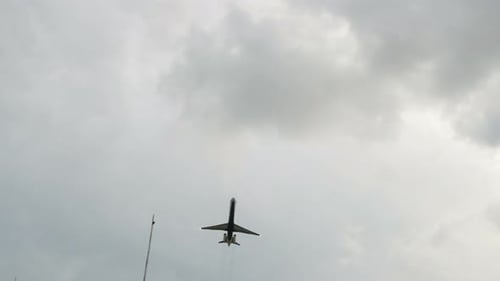 Airplane Takes Off From the Airport Above