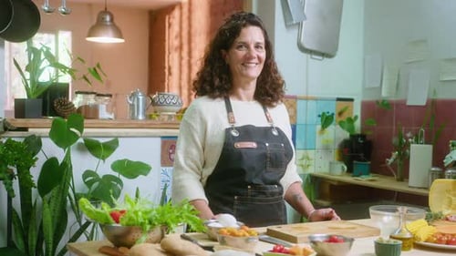 Woman Prepares Fresh Food in Sunny Kitchen
