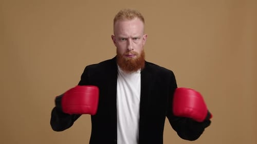 Bearded Man in Boxing Gloves Punches