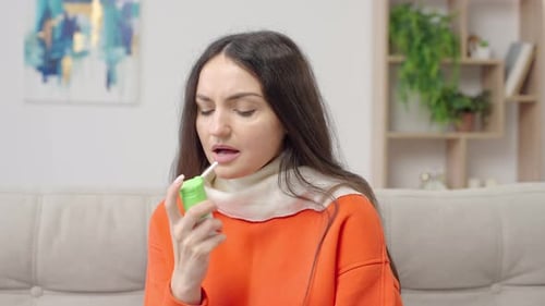 Woman Uses Throat Spray for Sore Throat