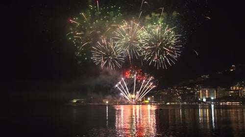 Fireworks with Colorful Lights Over Sea