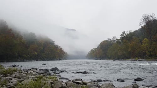 Static shot of the river Gorge flowing with low-lying mist