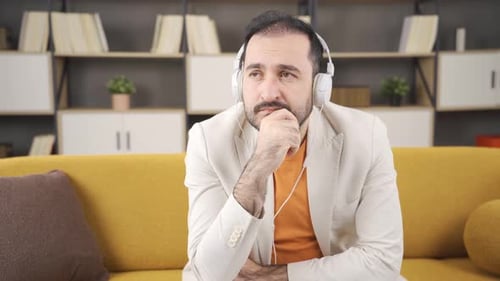Depressed man listens to slow music.