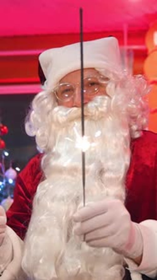 Man Dressed as Santa Holding Sparklers