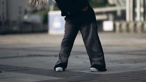 Young Woman Dancing Hip Hop on the Street