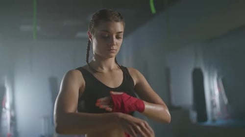 Female Fighter Wraps Her Hands with Boxing Bandages Kickboxing Training Day in a Gym Female Fighter