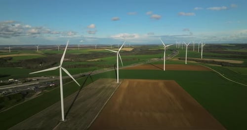 Renewable Energy Source Aerial View of Wind Turbines Standing on the Green Field Aerial View of a