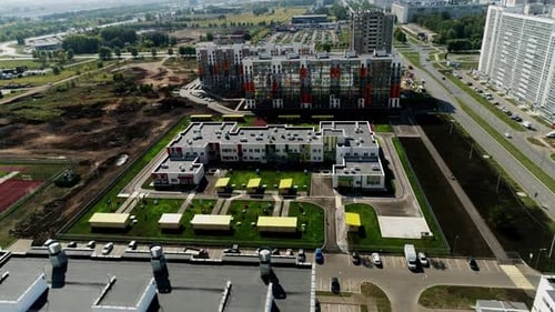 Multistory Residential Buildings Surround Central Road of City