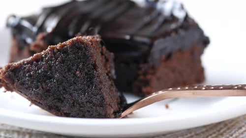 Decadent Chocolate Cake on a Plate with Fork