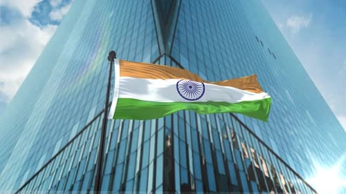 Indian Flag Waving Over Modern Corporate Skyscraper