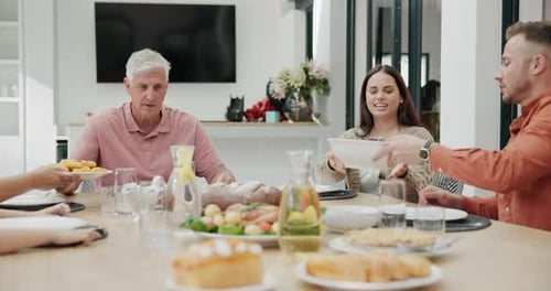 Family Shares a Meal Together at Home