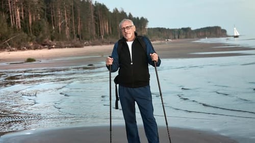Elderly Man 70s Grandfather Posing with Walking Stick at Beach Sea Wave Sunset Outdoor Sport