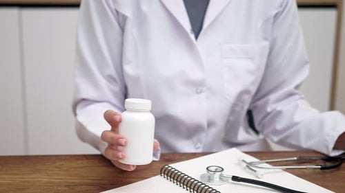 Healthcare Professional Explains Pills for Treatment
