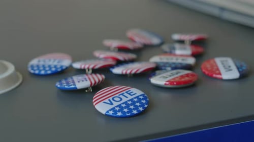 Badges with Vote Sign on Table at Polling Place