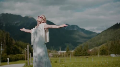 Woman Embracing Nature in a Lush Valley
