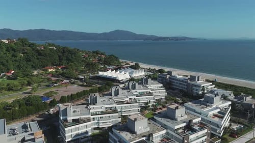 Aerial View of Beachfront Buildings and Event Tent