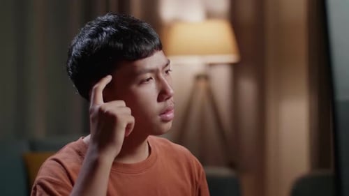 Close Up Of Asian Boy Footwear Designer Thinking While Working On A Desktop Computer At Home