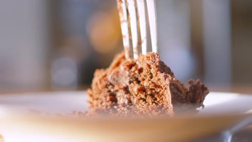 Fork Taking Piece of Chocolate Cake Close Up