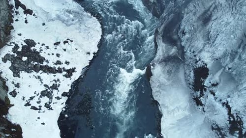 River in Huge Canyon Frozen Winter Landscape with Snow and Ice Aerial View Magical Tourist