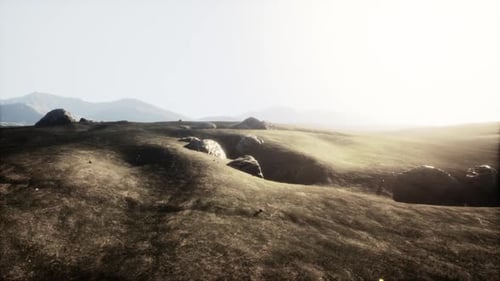 Serene Landscape with Rocky Outcrops at Dusk in a Mountainous Region
