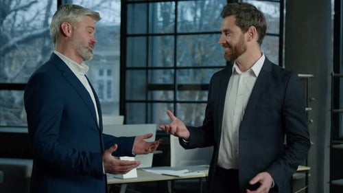 Two Happy Caucasian Men Businessmen Talking in Office Shake Hands After Successful Negotiations Man