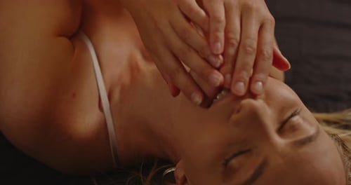 Blonde Woman Covering Her Face and Smiling