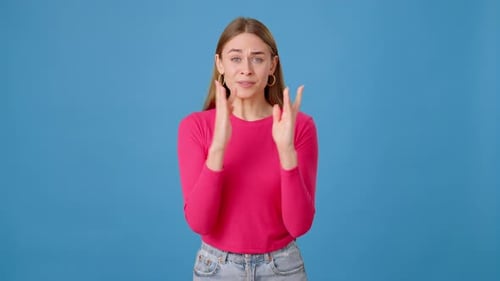 Young Woman Crossing Fingers and Celebrating Wish Come True