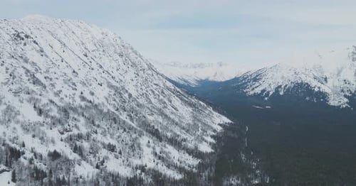 Aerial view of Mountains covered in snow in Alaska