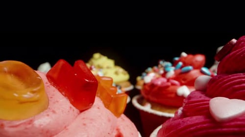 Festive Cupcakes Arranged on a Black Surface
