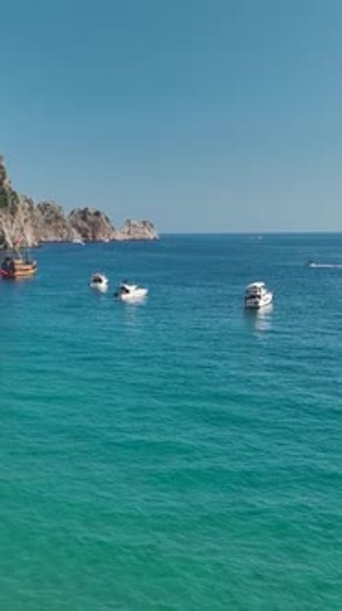 Boats Sailing on the Turquoise Ocean Water