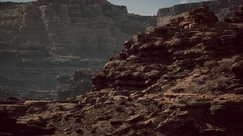 Dramatic Rock Formations Against a Rugged Landscape in Desert Terrain