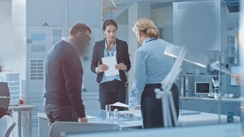 Scientists Collaborate on Research in Modern Laboratory Setting