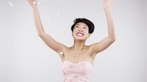Dance, confetti and woman in a studio in celebration of a happy birthday or party alone in Tokyo